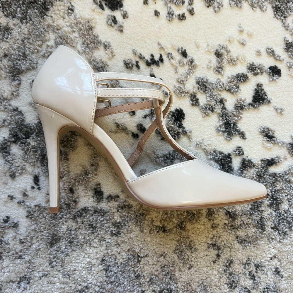 Never worn cream patent two buckle t-strap stiletto heels.